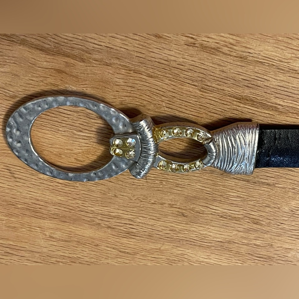 Vintage Chico’s black leather belt with silver and rhinestone buckle.
20”-38”